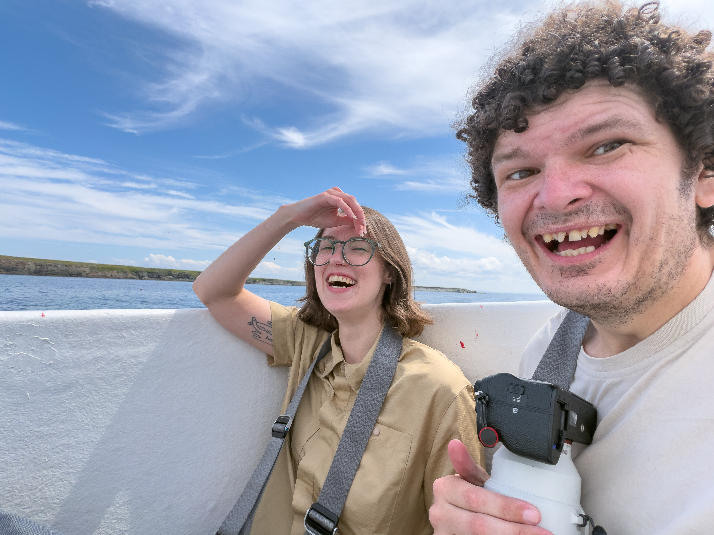 Ben is pictured on a boat with his best friend Emily while both are laughing riotously at the idea of being pictured on a boat